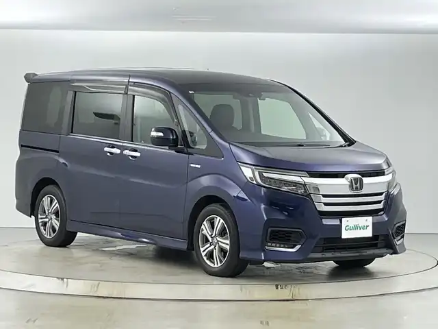 ホンダ ステップワゴン スパーダ ハイブリッド G EX ホンダセンシング 愛知県 2018(平30)年 7万km オブシダンブルーパール 純正9インチナビ/（CD/DVD/USB/Bluetooth/フルセグTV)/バックカメラ/ホンダセンシング/・衝突軽減ブレーキ〈CMBS〉/・ACC〈アダプティブ・クルーズ・コントロール〉/・LKAS〈車線維持支援システム〉/・路外逸脱抑制機能/・誤発進抑制機能/・先行車発進お知らせ機能/・標識認識機能/ETC/純正ドライブレコーダー/シートヒーター/両側パワースライドドア/わくわくゲート/アイドリングストップ/プッシュスタート/スマートキー/純正フロアマット/純正16インチアルミホイール/LEDヘッドライト/フロントフォグランプ/横滑り防止装置