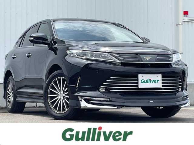 トヨタ ハリアー プログレス スタイルブルーイッシュ 愛媛県 2019(平31)年 9.8万km ブラックマイカ 純正ナビ　/フルセグTV/BT/CD/DVD/BD/全周囲カメラ　/モデリスタエアロ　/JBLサウンド/トヨタセーフティセンス　/レーダークルーズコントロール　/D/N席パワーシート　/D/N席シートヒーター　　/D/N席シートエアコン　/D席シートメモリー機能/電動リアゲート/スペアキー1本/カードキー1枚/電動パーキングブレーキ/AutoHold/ヒートミラー/電格ミラー/後付スマホ置き/現状社外ステアリングホイール/積込純正ステアリングホイール/ETC/コムテックレーダー探知機/純正ラゲッジマット/TRDドアハンドルプロテクター/LEDヘッドライト/現状サマー(社外AW)(235/55/R18)/TOYO TIRES　PROXESCL1SUV/積込スタッドレス(純正AW)(225/60/R18)/PIRELLI ICE ZERO