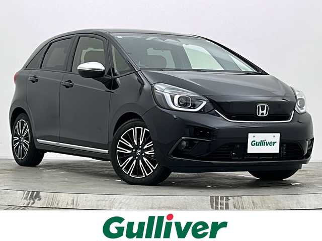 ホンダ フィット リュクス 宮城県 2020(令2)年 1.1万km クリスタルブラックパール 純正9型ナビ/(AM/FM/TV/BT/SD/USB/iPod/CD/DVD)/バックカメラ/ETC/前後ドライブレコーダー/アダプティブクルーズコントロール/ハーフレザー/シートヒーター/プッシュスタート/スマートキー/オートライト/オートマチックハイビーム/LEDヘッドライト/フォグランプ/ヘッドライトレベライザー/純正フロアマット/純正16インチアルミホイール/禁煙車