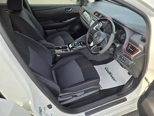 日産 リーフ ニスモ 鹿児島県 2018(平30)年 0.8万km ブリリアントホワイトパール プロパイロット　/パーキングアシスト　/ビルトインＥＴＣ　/デジタルインナーミラー　/前後ドライブレコーダー　/純正ＳＤナビ　/Ｂｌｕｅｔｏｏｔｈオーディオ　/前後コーナーセンサー　/ビークルダイナミクスコントロール/D+N席シートヒーター/プッシュスタート/スマートキー/エアバッグ(Wエアバッグ)