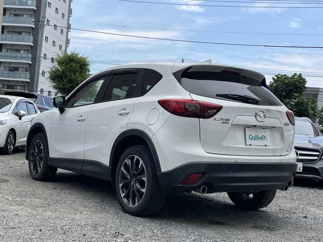マツダ ＣＸ－５ XD Lパッケージ 東京都 2015(平27)年 5.4万km クリスタルホワイトパールマイカ ワンオーナー/4WD/ターボ/純正HDDナビ/ (フルセグTV/Bluetooth/DVD/USB)/バックカメラ・サイドカメラ/レザーシート/前席パワーシート/前席シートヒーター/i-ACTIVSENSE/・マツダレーダークルーズコントロール（MRCC）/・スマートブレーキサポート（SBS）/・アドバンストスマートシティブレーキサポート（アドバンストSCBS）/・レーンキープアシストシステム＆車線逸脱警報システム（LAS & LDWS）/・ブラインドスポットモニタリング（BSM）/横滑り防止装置/純正19インチアルミホイール/スマートキー/オートライト/純正LEDヘッドライト/純正フロアマット/保証書/取扱説明書