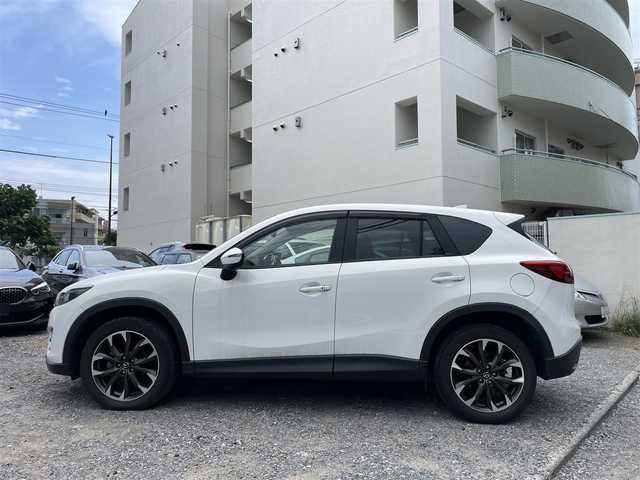 マツダ ＣＸ－５ XD Lパッケージ 東京都 2015(平27)年 5.4万km クリスタルホワイトパールマイカ ワンオーナー/4WD/ターボ/純正HDDナビ/ (フルセグTV/Bluetooth/DVD/USB)/バックカメラ・サイドカメラ/レザーシート/前席パワーシート/前席シートヒーター/i-ACTIVSENSE/・マツダレーダークルーズコントロール（MRCC）/・スマートブレーキサポート（SBS）/・アドバンストスマートシティブレーキサポート（アドバンストSCBS）/・レーンキープアシストシステム＆車線逸脱警報システム（LAS & LDWS）/・ブラインドスポットモニタリング（BSM）/横滑り防止装置/純正19インチアルミホイール/スマートキー/オートライト/純正LEDヘッドライト/純正フロアマット/保証書/取扱説明書
