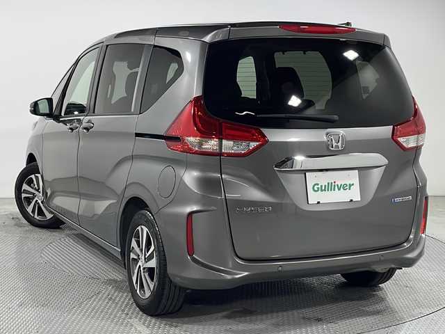 ホンダ フリード ハイブリット G 広島県 2022(令4)年 1万km スーパープラチナグレーメタリック 禁煙車/純正９型ナビ/シートヒーター/両側パワースライドドア/バックカメラ/ETC2.0/レーダークルーズコントロール/全方位ドラレコ/コーナーセンサー/衝突軽減/レーンキープアシスト/踏み間違い防止/LEDヘッドライト/純正15インチアルミホイール(185/65/R15)/エアバッグ(運転席/助手席)