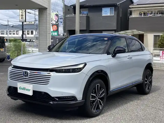 ホンダ ヴェゼル ハイブリッド e:HEV Z PLaYパッケージ 兵庫県 2025(令7)年 0.1千km プレミアムサンライトホワイトパール ワンオーナー/純正ナビ/フルセグTV/Bluetooth/FM/AM/OPマルチビューカメラシステム/OPパノラマルーフ/ビルトインETC2.0/衝突被害軽減ブレーキ/踏み間違い衝突軽減/ブラインドスポットアシスト/路外逸脱抑制機能/アダプティブクルーズコントロール/パワーバックドア/D/Nシートヒーター/ステアリングヒーター/ハーフレザーシート/パドルシフト/前後クリアランスソナー/LEDヘッドライト/フォグランプ/オートライト/シーケンシャルウィンカー/電格ミラー/フロアマット/ISOFIX/スペアキー1本/新車時保証書/取扱説明書