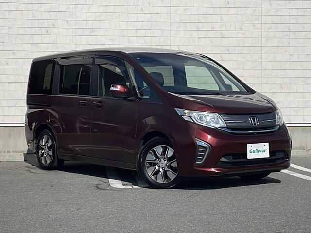 ホンダ ステップワゴン G EX 山形県 2015(平27)年 5.1万km プレミアムディープロッソパール Honda SENSING/・衝突軽減ブレーキ（ＣＭＢＳ）/・路外逸脱抑制機能/・先行車発進お知らせ機能/・アダプティブクルーズコントロール（ＡＣＣ）/・車線維持支援システム（ＬＫＡＳ）/・標識認識機能/・誤発進抑制機能 /両側パワースライドドア/純正フリップダウンモニター/純正ナビ(CD.DVD.SD.BT.USB.HDMI)/フルセグ/マルチビューカメラ/ビルトインETC/シートヒーター/プッシュスタート/スマートキー/LEDヘッドライト