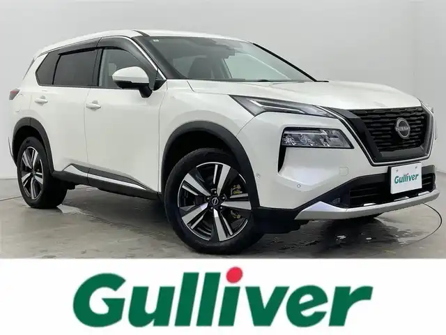 日産 エクストレイル G e－4ORCE 富山県 2024(令6)年 0.3万km ブリリアントホワイトパール 4WD/純正12.3インチナビ/（AM/FM/USB/BT/AppleCarPlay/AndroidAuto）/フルセグTV/アラウンドビューモニター/ヘッドアップディスプレイ/プロパイロット/エマージェンシーブレーキ/アダプティブクルーズコントロール/ブラインドスポットモニター/オートマチックハイビーム/レーンキープアシスト/クリアランスソナー/電動リアゲート/合皮シート/全席シートヒーター/前席パワーシート/ステアリングヒーター/前後ドライブレコーダー/デジタルインナーミラー/ビルトインETC2.0/置くだけ充電/スマートキー×２/プッシュスタート/純正フロアマット/取扱説明書/保証書