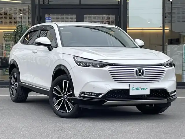 ホンダ ヴェゼル ハイブリッド e:HEV Z 茨城県 2024(令6)年 0.7万km プラチナホワイトパール 純正ナビ/【ＣＤ・ＤＶＤ・ラジオ・TV・iPod・SD・USB・BT・AUX】/シートヒーター/ステアリングヒーター/BSM/パドルシフト/レーダークルコン/ETC/Bカメラ/前後ドラレコ/前後コーナーセンサー/ダウンヒルアシストコントロール/電動リアゲート/社外フロアマット/純正アルミホイール/オートライト/Fフォグ/LEDライト