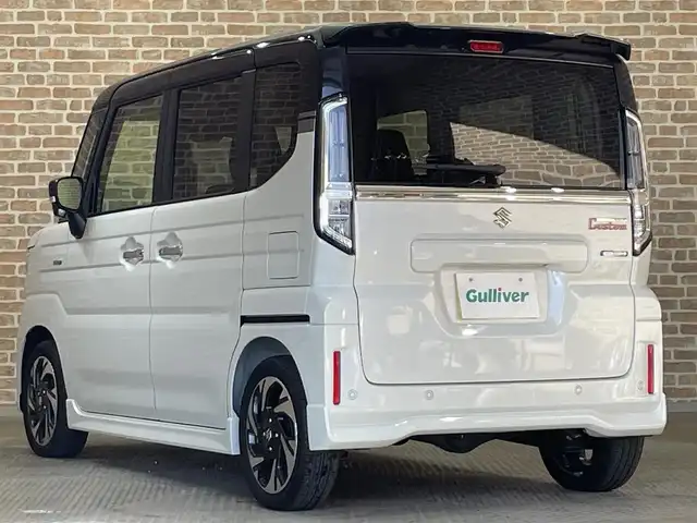 スズキ スペーシア カスタム HYBRID XS 岩手県 2024(令6)年 0.1万km ピュアホワイトパール/ブラック2トーン ４WD/オプション ブラック2トーンルーフ/スリムサーキュレーター/ロールサンシェード/前席シートヒーター/ステアリングヒーター/マルチユースフラップ/両側パワースライドドア/スズキセーフティサポート/デュアルセンサーブレーキサポートII/車線逸脱抑制機能/アダプティブクルーズコントロール/車線維持支援機能/誤発進抑制機能/標識認識機能/先行車発信お知らせ機能/リヤパーキングセンサー/ハイビームアシスト/横滑り防止装置/アイドリングストップ/LEDヘッドライト/純正１５インチアルミホイール