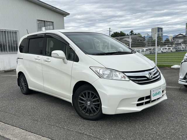 ホンダ フリード G ジャストセレクション 富山県 2013(平25)年 10.3万km プレミアムホワイトパール ワンオーナー/スマートキー×２/両側パワースライドドア/社外メモリーナビ(NR-MZ50)/DVD/MSV/DVD/フルセグTV/ETC/クルーズコントロール/電格ウィンカーミラー/HIDヘッドライト/純正フロアマット/純正マッドガード/ドアバイザー/ステアリングスイッチ/保証書・取説・ナビ取説/社外AWノーマルタイヤ車載(185/65R15)
