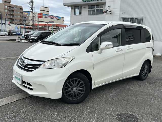 ホンダ フリード G ジャストセレクション 富山県 2013(平25)年 10.3万km プレミアムホワイトパール ワンオーナー/スマートキー×２/両側パワースライドドア/社外メモリーナビ(NR-MZ50)/DVD/MSV/DVD/フルセグTV/ETC/クルーズコントロール/電格ウィンカーミラー/HIDヘッドライト/純正フロアマット/純正マッドガード/ドアバイザー/ステアリングスイッチ/保証書・取説・ナビ取説/社外AWノーマルタイヤ車載(185/65R15)