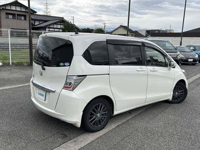 ホンダ フリード G ジャストセレクション 富山県 2013(平25)年 10.3万km プレミアムホワイトパール ワンオーナー/スマートキー×２/両側パワースライドドア/社外メモリーナビ(NR-MZ50)/DVD/MSV/DVD/フルセグTV/ETC/クルーズコントロール/電格ウィンカーミラー/HIDヘッドライト/純正フロアマット/純正マッドガード/ドアバイザー/ステアリングスイッチ/保証書・取説・ナビ取説/社外AWノーマルタイヤ車載(185/65R15)