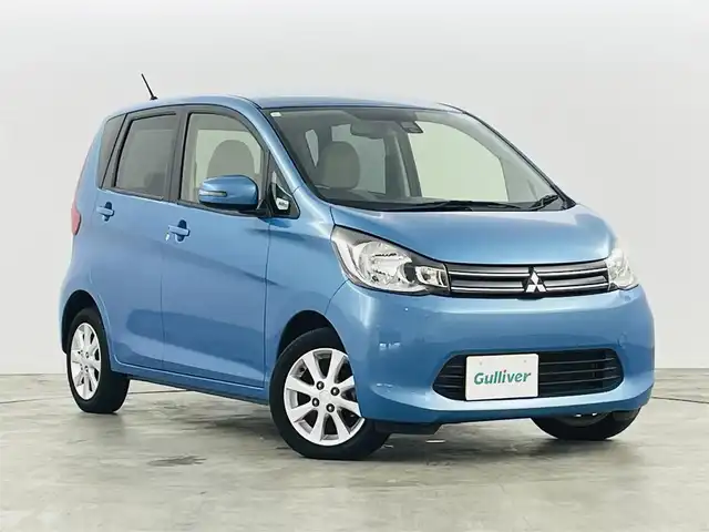 三菱 ｅＫワゴン G e－アシスト 福島県 2014(平26)年 8万km ブリリアントターコイズM Ｅ－アシスト　/・衝突被害軽減システム/メモリナビゲーション/・型番：AVN135MW　/バックカメラ　/アイドリングストップ　/革巻きステアリング　/プッシュスタート　/・スマートキー　/ヘッドライトレベライザー　/・フォグライト　/純正フロアマット　/電動格納ミラー/取扱説明書/・保証書