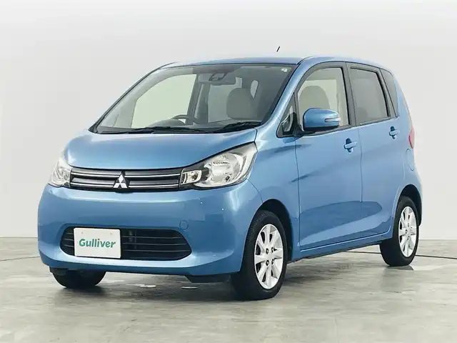 三菱 ｅＫワゴン G e－アシスト 福島県 2014(平26)年 8万km ブリリアントターコイズM Ｅ－アシスト　/・衝突被害軽減システム/メモリナビゲーション/・型番：AVN135MW　/バックカメラ　/アイドリングストップ　/革巻きステアリング　/プッシュスタート　/・スマートキー　/ヘッドライトレベライザー　/・フォグライト　/純正フロアマット　/電動格納ミラー/取扱説明書/・保証書