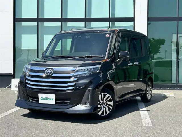 トヨタ ルーミー カスタムG 和歌山県 2021(令3)年 2.3万km ブラックマイカメタリック 社外ナビ/フルセグTV/バックカメラ/（BT/CD/DVD)/プリクラッシュセーフティー/レーダークルーズコントロール/レーンディパーチャーアラート/クリアランスソナー/横滑り防止装置/両側パワースライドドア/アイドリングストップ/純正アルミホイール/革巻きステアリング/LEDヘッドライト/フォグランプ/オートライト/オートマチックハイビーム