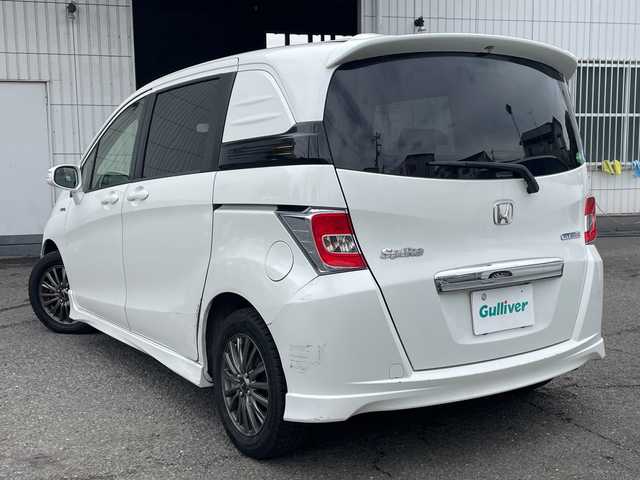 ホンダ フリード スパイク ハイブリット 神奈川県 2015(平27)年 10万km ホワイトオーキッドパール ワンオーナー/純正ナビ/ワンセグテレビ/BT/バックカメラ/クルーズコントロール/ステアリングスイッチ/ETC/電動格納ミラー/フロアマット