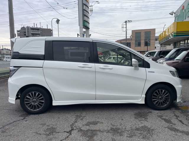 ホンダ フリード スパイク ハイブリット 神奈川県 2015(平27)年 10万km ホワイトオーキッドパール ワンオーナー/純正ナビ/ワンセグテレビ/BT/バックカメラ/クルーズコントロール/ステアリングスイッチ/ETC/電動格納ミラー/フロアマット