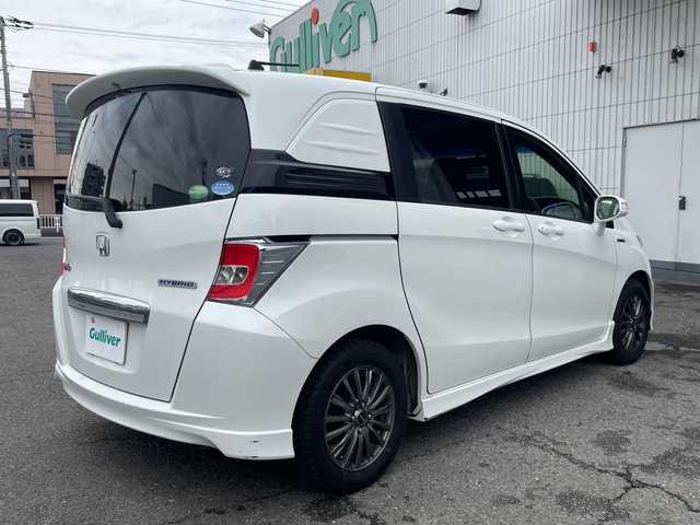 ホンダ フリード スパイク ハイブリット 神奈川県 2015(平27)年 10万km ホワイトオーキッドパール ワンオーナー/純正ナビ/ワンセグテレビ/BT/バックカメラ/クルーズコントロール/ステアリングスイッチ/ETC/電動格納ミラー/フロアマット