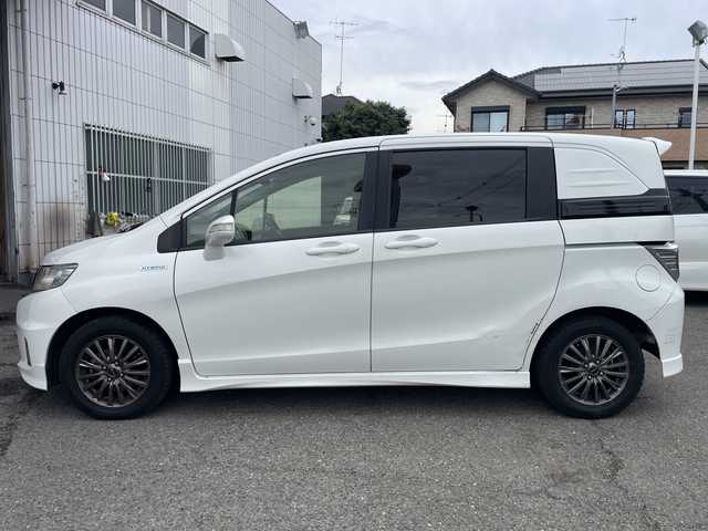 ホンダ フリード スパイク ハイブリット 神奈川県 2015(平27)年 10万km ホワイトオーキッドパール ワンオーナー/純正ナビ/ワンセグテレビ/BT/バックカメラ/クルーズコントロール/ステアリングスイッチ/ETC/電動格納ミラー/フロアマット