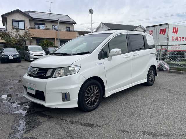 ホンダ フリード スパイク ハイブリット 神奈川県 2015(平27)年 10万km ホワイトオーキッドパール ワンオーナー/純正ナビ/ワンセグテレビ/BT/バックカメラ/クルーズコントロール/ステアリングスイッチ/ETC/電動格納ミラー/フロアマット