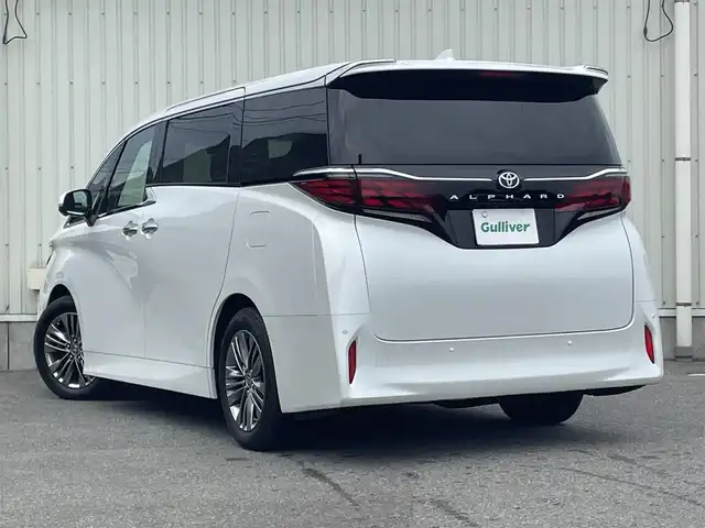 トヨタ アルファード Z 山形県 2024(令6)年 0.9万km プラチナホワイトパールマイカ ワンオーナー/寒冷地仕様車/トヨタセーフティセンス/左右独立ムーンルーフ/純正14インチコネクティッドナビ/フルセグTV/全方位カメラ/両側パワースライドドア/パーキングアシスト/黒革シート/シートヒーター、エアシート/前席二列目パワーシート/デジタルインナーミラー/ステアリングスイッチ/レーダークルーズコントロール/ETC2.0/プロジェクションカーテシイルミ/スカッフイルミネーション/オートホールド/横滑り防止装置/パワーバッグドア/BSM/純正アルミホイール/LEDライト/フォグランプ/ウィンカーミラー/保証書、取説あり/スペアキーあり