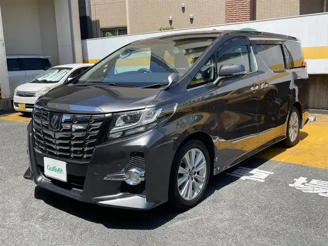 トヨタ アルファード S Aパッケージ 静岡県 2015(平27)年 13.9万km グレーメタリック 純正9インチナビ/フルセグTV/DVD/CD/BT/SD/MSV/バックカメラ/両側パワースライドドア/バックドアイージークローザー/衝突軽減ブレーキ/レーダークルーズコントロール/クリアランスソナー/スペアタイヤ/ビルトインETC/前後ドライブレコーダー/ステアリングスイッチ/LEDヘッドライト/純正18インチAW/スマートキー×2/保証書/取扱説明書/ナビ取扱説明書/R2/4/5/6/7点検記録簿有