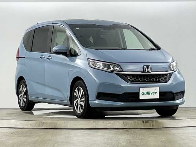 ホンダ フリード ハイブリット G ホンダセンシング 愛知県 2021(令3)年 1.9万km シーグラスブルーパール 禁煙車/純正９インチナビ/（CD/DVD/フルセグTV/Bluetooth/USB)/バックカメラ/ホンダセンシング/・衝突軽減ブレーキ/・レーンキープアシスト/・追従式クルーズコントロール/・クリアランスソナー/・オートマチックハイビーム/前後ドライブレコーダー/ETC/シートヒーター/両側パワースライドドア/スマートキー/スペアキー有/純正15インチアルミホイール/純正フロアマット/横滑り防止装置/アイドリングストップ