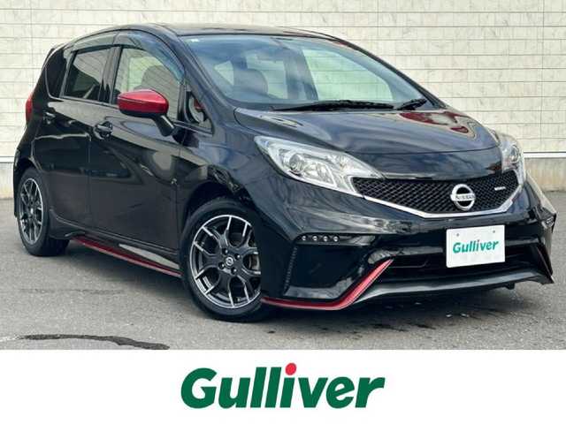 日産 ノート ニスモ 岐阜県 2015(平27)年 6万km スーパーブラック 純正ＳＤナビ（フルセグTV・Ｂｌｕｅｔｏｏｔｈ・ＣＤ・ＵＳＢ）　/バックカメラ　/横滑り防止装置/革巻きステアリング/ＬＥＤヘッドライト　/デイライト/リアフォグランプ　/ＥＴＣ　/アイドリングストップ　/nismo専用シート/純正フロアマット　/純正１６インチアルミホイール　/ドアバイザー/オートライト/スマートキー×２/プッシュスタート