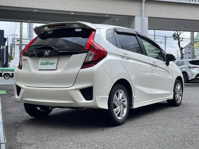 ホンダ フィット 13G Sパッケージ 高知県 2014(平26)年 13.7万km プレミアムホワイトパール 社外ナビ/バックモニター/オートライト