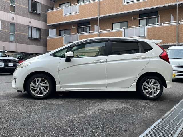 ホンダ フィット 13G Sパッケージ 高知県 2014(平26)年 13.7万km プレミアムホワイトパール 社外ナビ/バックモニター/オートライト