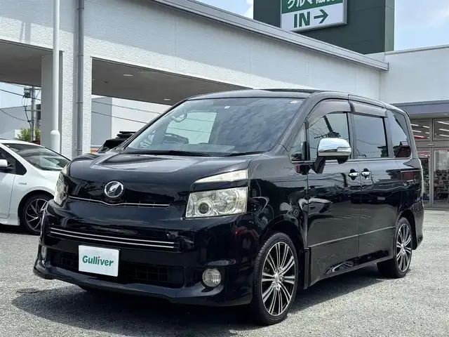 トヨタ ヴォクシー ZS 煌Ⅱ 熊本県 2009(平21)年 15.5万km ブラック 社外ナビ（CN-S300D）/【フルセグTV/Bluetooth/CD/DVD】/フリップダウンモニター/両側パワースライドドア/社外18インチAW/ETC/パドルシフト/革巻きステアリング/ダブルエアバック/オートライト/プッシュスタート/スマートキー/ステアリングスイッチ/ABS/盗難防止装置