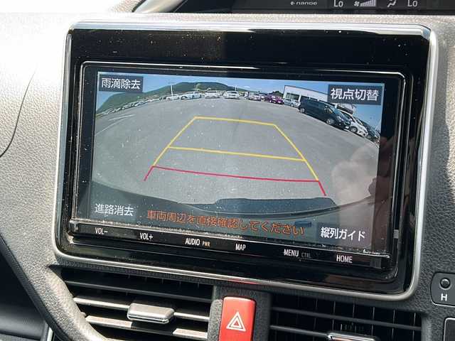 トヨタ ヴォクシー ZS 煌Ⅲ 鹿児島県 2021(令3)年 5.2万km ブラック トヨタセーフティセンス/-衝突被害軽減ブレーキ/-先行車発信告知機能/フリップダウンモニター/純正SDナビ　NXZT-Y68T/（CDDVD/フルセグテレビ/Bluetooth）/バックカメラ/両側パワースライドドア/クルーズコントロール/LEDヘッドライト・フォグ/オートライト/ハーフレザーシート/三列シート/純正16インチアルミホイール/アイドリングストップ/リアオートエアコン/スマートキー/ビルトインETC