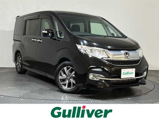 ホンダ ステップワゴン スパーダ 愛媛県 2015(平27)年 5.7万km プレミアムスパークルブラックパール ナビ【AVN-Z04i】/レーダークルーズコントロール/両側パワースライドドア/純正１６インチアルミホイール/純正フロアマット/衝突被害軽減システム/レーンキープアシスト/横滑り防止装置/盗難防止装置/バックカメラ/ETC/プッシュスタート/スマートキー