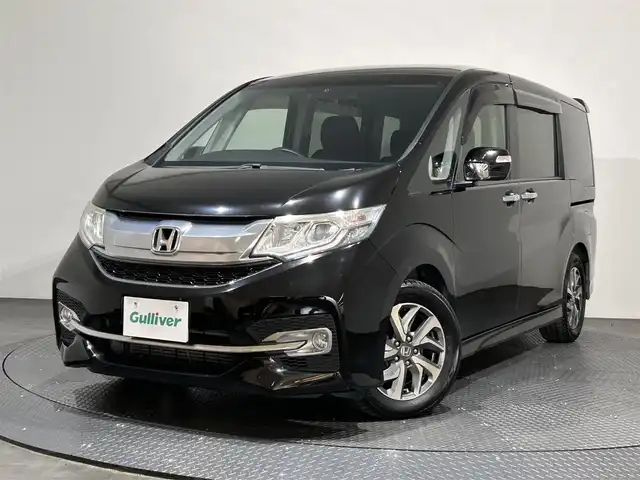 ホンダ ステップワゴン スパーダ 愛媛県 2015(平27)年 5.7万km プレミアムスパークルブラックパール ナビ【AVN-Z04i】/レーダークルーズコントロール/両側パワースライドドア/純正１６インチアルミホイール/純正フロアマット/衝突被害軽減システム/レーンキープアシスト/横滑り防止装置/盗難防止装置/バックカメラ/ETC/プッシュスタート/スマートキー