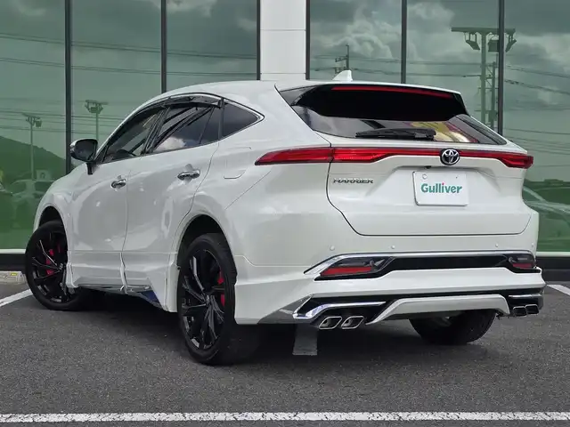 トヨタ ハリアー Z レザーパッケージ 福岡県 2021(令3)年 3.8万km ホワイトパールクリスタルシャイン ワンオーナー/モデリスタエアロ(フロント・サイド・リア)/純正12.3インチメーカーナビ　JBLプレミアムサウンド/【AM/FM/Bluetooth/フルセグTV】/全方位カメラ/デジタルインナーミラー/パワーバックドア/ビルトインETC2.0/ヘッドアップディスプレイ/前後ドライブレコーダー【DC-DR652】/トヨタセーフティセンス/プリクラッシュセーフティ/ブラインドスポットモニター/クリアランスソナー/リアクロストラフィックアラート/ロードサインアシスト/先行車発進告知機能/後退速度抑制機能/レーダークルーズコントロール/オートハイビーム/車線逸脱警報機能/車線逸脱抑制機能/ブレーキホールド/ステアリングヒーター/D/N席シートヒーター/D/N席エアシート/D/N席パワーシート/D席シートメモリ/黒レザーシート/純正20インチ黒色AW/純正フロアマット/横滑り防止装置/盗難防止装置/D/N席エアコン吹き出し口ドリンクホルダー/電格ウィンカーミラー/保証書/スペアキー×2