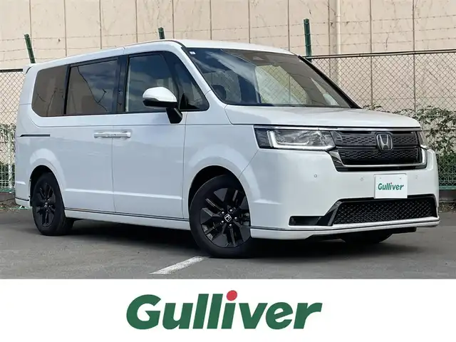 ホンダ ステップワゴン スパーダ 東京都 2024(令6)年 1.2万km プラチナホワイトパール Ｇａｔｈｅｒｓ純正８型ナビ　フルセグＴＶ　ＣＤ／ＤＶＤ　バックカメラ　追従クルーズ　ＢＳＭ　シートヒーター　両側パワースライドドア　電動リアゲート　ＥＴＣ　ドライブレコーダー　衝突被害軽減ブレーキ