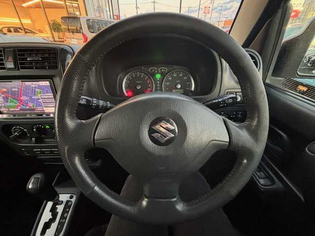 スズキ ジムニー ワイルドウィンド 宮城県 2007(平19)年 15.1万km パールホワイト 登録時走行距離150247km/パワーステアリング/パワーウインド/スペアキー有り/ACエアコン/Bluetooth接続/TV/AM/FM/SD/AUX/HIDヘッドライト/４WD/オフロードマッドタイヤ(ヨコハマ　ジオランダーG003)22年製/ヘッドライトレベライザー/純正フロアマット/純正アルミホイール/ABS/車高調リフトアップ/ルーフレールキャリア付き