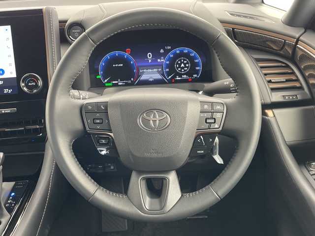 トヨタ アルファードハイブリット X 愛知県 2025(令7)年 0.5万km プラチナホワイトパールマイカ 純正9型ディスプレイオーディオ　ナビ機能なし/フリップダウンモニター/全方位カメラ/三眼LEDヘッドライト/両側パワースライドドア/レーダークルーズコントロール/バックカメラ/コーナーセンサー/純正アルミホイール/ETC2.0/ブラインドスポットモニター/リアオートエアコン/オートマチックハイビーム/衝突軽減システム/フルセグ/Bluetooth/ステアリングスイッチ/スマートキー/プッシュスタート