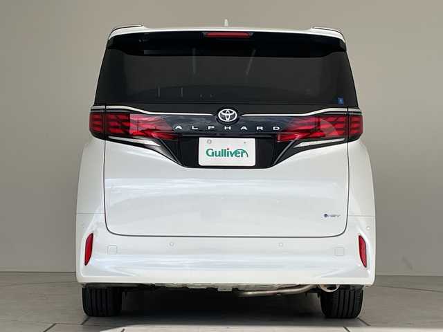 トヨタ アルファードハイブリット X 愛知県 2025(令7)年 0.5万km プラチナホワイトパールマイカ 純正9型ディスプレイオーディオ　ナビ機能なし/フリップダウンモニター/全方位カメラ/三眼LEDヘッドライト/両側パワースライドドア/レーダークルーズコントロール/バックカメラ/コーナーセンサー/純正アルミホイール/ETC2.0/ブラインドスポットモニター/リアオートエアコン/オートマチックハイビーム/衝突軽減システム/フルセグ/Bluetooth/ステアリングスイッチ/スマートキー/プッシュスタート