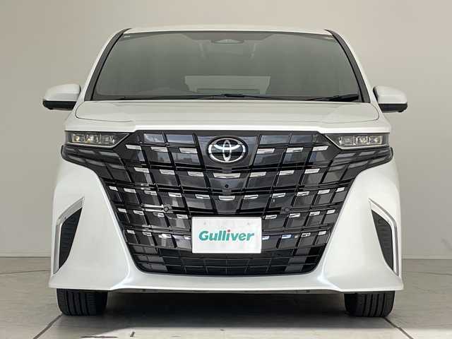 トヨタ アルファードハイブリット X 愛知県 2025(令7)年 0.5万km プラチナホワイトパールマイカ 純正9型ディスプレイオーディオ　ナビ機能なし/フリップダウンモニター/全方位カメラ/三眼LEDヘッドライト/両側パワースライドドア/レーダークルーズコントロール/バックカメラ/コーナーセンサー/純正アルミホイール/ETC2.0/ブラインドスポットモニター/リアオートエアコン/オートマチックハイビーム/衝突軽減システム/フルセグ/Bluetooth/ステアリングスイッチ/スマートキー/プッシュスタート