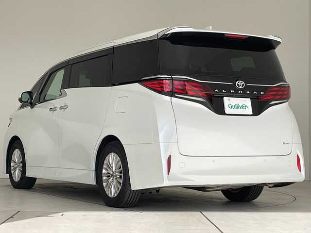 トヨタ アルファードハイブリット X 愛知県 2025(令7)年 0.5万km プラチナホワイトパールマイカ 純正9型ディスプレイオーディオ　ナビ機能なし/フリップダウンモニター/全方位カメラ/三眼LEDヘッドライト/両側パワースライドドア/レーダークルーズコントロール/バックカメラ/コーナーセンサー/純正アルミホイール/ETC2.0/ブラインドスポットモニター/リアオートエアコン/オートマチックハイビーム/衝突軽減システム/フルセグ/Bluetooth/ステアリングスイッチ/スマートキー/プッシュスタート