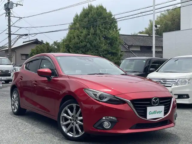 マツダ アクセラ スポーツ XD 熊本県 2015(平27)年 14万km ソウルレッドプレミアムメタリック ワンオーナー/サンルーフ/純正HDDナビ/【フルセグTV/CD/DVD/Bluetooth】/バックカメラ/衝突被害軽減システム/レーダークルーズコントロール/レーンキープアシスト/コーナーセンサー/ハーフレザーシート/パワーシート(D席)/前席シートヒーター/純正18インチアルミホイール/オートLEDライト/オートマチックハイビーム/ETC/ドライブレコーダー/アイドリングストップ/横滑り防止装置/盗難防止装置/純正フロアマット/ダブル＋サイドエアバック/プッシュスタート/スマートキー/取扱説明書/保証書