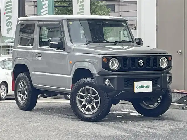 スズキ ジムニー XC 宮城県 2020(令2)年 2.4万km ミディアムグレー 4WD/4WD切り替えスイッチ/JAOS40mmアップキット（純正あり）/スイスポ用リアフォブスイッチ（純正あり）/CLLINK背面ボックス/純正ナビ/FM/AM/i Pod/USB/BT/CD/DVD/フルセグTV/バックカメラ/ステアリングスイッチ/前席シートヒーター/社外デジタルインナーミラー/純正アルミ冬タイヤ16インチ/積み込み社外アルミ夏タイヤ/クルーズコントロール/横滑り防止装置/衝突被害軽減システム/ダウンヒルアシストコントロール/レーンキープアシスト/盗難防止装置/社外フロアマット/ウィンカードアミラー/電動格納ミラー/社外前後ドライブレコーダー/LEDライト/ETC/プッシュスタート/保証書・記録簿・取扱説明書