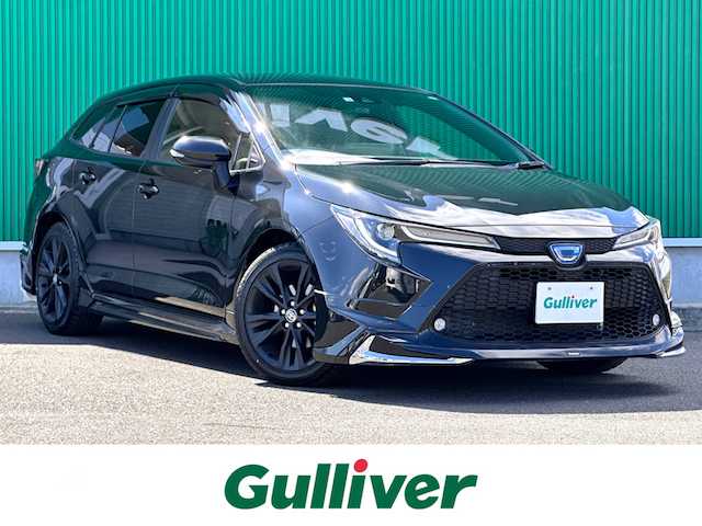 トヨタ カローラツーリング ハイブリッド ダブルバイビー 宮城県 2022(令4)年 2.4万km ブラックマイカ 9インチディスプレイオーディオ/・Bluetooth/・フルセグTV/・ナビ機能/ブラインドスポットモニターセット/・ブラインドスポットモニター/・リアクロストラフィックオートブレーキ/寒冷地仕様/＝＝＝/モデリスタエアロ（F/S/R）/セーフティセンス/・プリクラッシュセーフティ/・レーントレーシングアシスト/・全車速追従機能付レーダークルーズコントロール/・オートマチックハイビーム/・ロードサインアシスト/インテリジェントクリアランスソナー/バックモニター/ビルトインETC/ハーフレザーシート/革巻きステアリング/ステアリングスイッチ/電動パーキングブレーキ/ブレーキホールド/LEDヘッドランプ/LEDデイライト/フォグランプ/オートライト/スマートキー＆プッシュスタート/スペアキー/電動格納ミラー/純正17インチAW/フロアマット/ドアバイザー/W/サイド/カーテンエアバッグ/取扱説明書/保証書