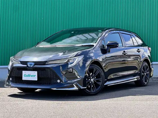 トヨタ カローラツーリング ハイブリッド ダブルバイビー 宮城県 2022(令4)年 2.4万km ブラックマイカ 9インチディスプレイオーディオ/・Bluetooth/・フルセグTV/・ナビ機能/ブラインドスポットモニターセット/・ブラインドスポットモニター/・リアクロストラフィックオートブレーキ/寒冷地仕様/＝＝＝/モデリスタエアロ（F/S/R）/セーフティセンス/・プリクラッシュセーフティ/・レーントレーシングアシスト/・全車速追従機能付レーダークルーズコントロール/・オートマチックハイビーム/・ロードサインアシスト/インテリジェントクリアランスソナー/バックモニター/ビルトインETC/ハーフレザーシート/革巻きステアリング/ステアリングスイッチ/電動パーキングブレーキ/ブレーキホールド/LEDヘッドランプ/LEDデイライト/フォグランプ/オートライト/スマートキー＆プッシュスタート/スペアキー/電動格納ミラー/純正17インチAW/フロアマット/ドアバイザー/W/サイド/カーテンエアバッグ/取扱説明書/保証書