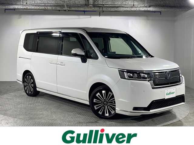ホンダ ステップワゴン スパーダ eHEV プレミアムライン 沖縄県 2022(令4)年 2.9万km プラチナホワイトパール 県外仕入れ/禁煙車/7人乗り/純正11.4インチコネクトナビ/（フルセグTV CD DVD Bluetooth)/マルチビューカメラシステム/ブラインドスポットインフォメーション/Honda SENSING/●衝突軽減ブレーキ（CMBS）●誤発進抑制機能●後方誤発進抑制機能●近距離衝突軽減ブレーキ●歩行者事故低減ステアリング●路外逸脱抑制機能●渋滞追従機能付アダプティブクルーズコントロール（ACC）●車線維持支援システム（LKAS）●トラフィックジャムアシスト（渋滞運転支援機能）●先行車発進お知らせ機能●標識認識機能●オートハイビーム●アダプティブドライビングビーム/アダプティブドライビングビーム/パワーテールゲート(メモリー機能付)/2列目オットマン/運転席＆助手席シートヒーター/2列目シートヒーター/トリプルゾーンコントロール・フルオートエアコンディショナー/コンビシート(PREMIUM LINE専用)/17インチアルミホイール(PREMIUM LINE専用)/減速セレクター/全列USBチャージャー/パドルシフト/コーナーセンサー
