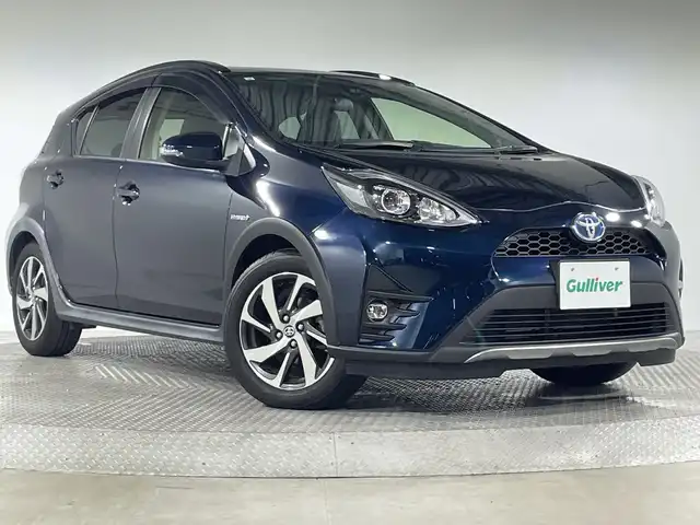 トヨタ アクア クロスオーバー 神奈川県 2017(平29)年 7.4万km ブラッキッシュアゲハガラスフレーク トヨタセーフティセンス/純正9型SDナビゲーション【NSZT-Y66T】/・BT/フルセグTV/CD/DVD/SD/バックカメラ/ハーフレザーシート/ビルトインETC/ECO/EVモード/スマートキー/プッシュスタートボタン/革巻きステアリング/ステアリングスイッチ/Autoライト/LEDヘッドライト/フォグランプ/ルーフレール/電動格納ミラー/ウィンカーミラー/シートリフター/純正フロアマット/純正ドアバイザー/純正16インチアルミホイール