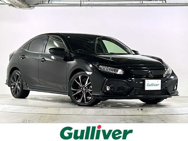 ホンダ シビック ハッチバック 広島県 2018(平30)年 5.7万km クリスタルブラックパール 禁煙/Honda SENSING/・衝突軽減ブレーキ〈CMBS〉/・渋滞追従機能付アダプティブ・クルーズ・コントロール/・LKAS〈車線維持支援システム〉/・路外逸脱抑制機能/・オートハイビーム/・標識認識機能/アジャイルハンドリングアシスト/純正ナビ（VXM-185VFi）/・フルセグ/CD/DVD/Bluetooth/SD/バックカメラ/革巻きステアリング/ステアリングスイッチ/パドルシフト/オートライト/シートヒーター/電動パーキングブレーキ/ブレーキホールド/スマートキー/プッシュスタート/スペアキー/純正前後ドライブレコーダー/ETC/トノカバー/カロッツェリアサブウーファー（TB-WX130DA）/ピアノブラック・フロントグリル/フロントスポイラー/純正１８インチアルミホイール/W+サイド+カーテンエアバック