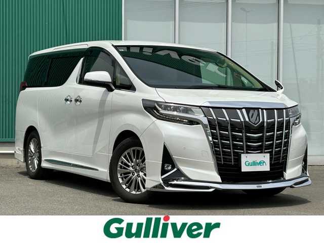 トヨタ アルファード G 福岡県 2019(令1)年 7.8万km 白 ・PUSHスタート/・パワーステアリング/・パワーウィンドウ/・100V充電/・スマートキー/・WAC/・クルーズコントロール/・オートライト/・BT/・純正後席モニター/・CDチェンジャー/・純正ビルトインETC/・バックカメラ/・フルセグ/・オートマチックハイビーム/・純正カーナビ/・3列シート/・オットマン/・前後ドラレコ/・ウォークスルー/・純正フロアマット/・D+N席パワーシート/・レザーシート/・エアロパーツ(モデリスタ)/・純正アルミホイール/・ABS/・横滑り防止装置/・Wエアバッグ＋サイドエアバッグ/・衝突被害軽減システム/・レーンキープアシスト/・盗難防止装置