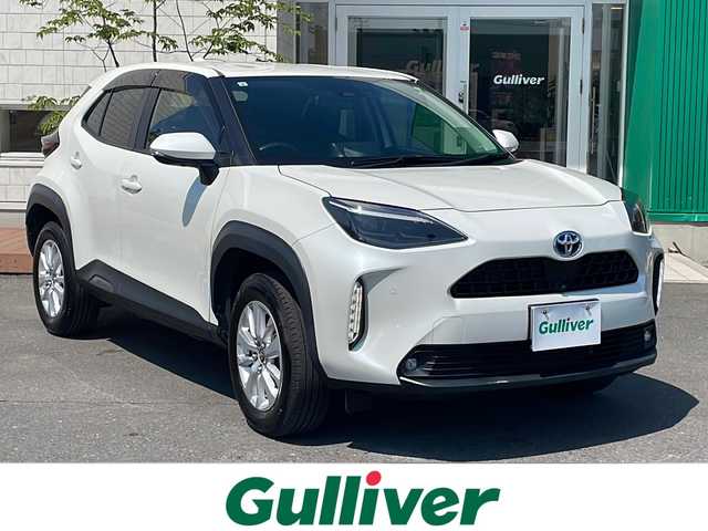トヨタ ヤリスクロス ハイブリッド G 青森県 2021(令3)年 7万km ホワイトパールクリスタルシャイン 4WD/純正8インチディスプレイオーディオ/フルセグTV・Bluetooth・USB/OPパノラミックビューモニター/OPパワーバックドア/セーフティセンス/プリクラッシュセーフティ/レーダークルーズコントロール/レーントレーシングアシスト/オートマチックハイビーム/クリアランスソナー/OPブラインドスポットモニター/ビルトインETC/LEDヘッドライト/純正16インチアルミ/スマートキー/プッシュスタート