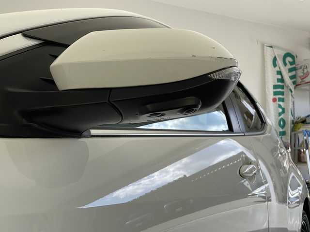 トヨタ ヤリス ハイブリッド Z 長野県 2024(令6)年 0.5万km スーパーホワイトⅡ 純正メモリナビ/Bluetooth／AM／FM/全方位カメラ/ETC/横滑り防止装置/衝突被害軽減システム/レーンキープアシスト/自動駐車システム/社外15インチAW装着/純正フロアマット/ドアバイザー/ヘッドライトレベライザー/クルーズコントロール/ハーフレザー/前席シートヒーター/前後コーナーセンサー/電格ミラー/LEDヘッドライト/スマートキー/スペアキー1本
